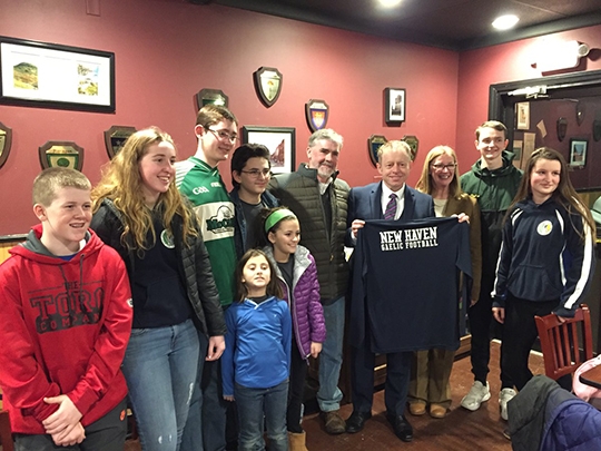 Minister Cannon with New Haven Gaelic football shirt