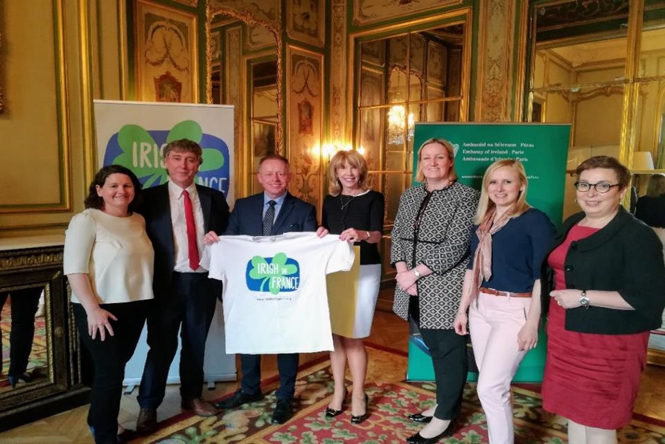 Some members of The Irish in France board, and Honorary President Ambassador Patricia O’Brien present Minister of State Cannon with an Irish in France T Shirt during his visit to Paris.